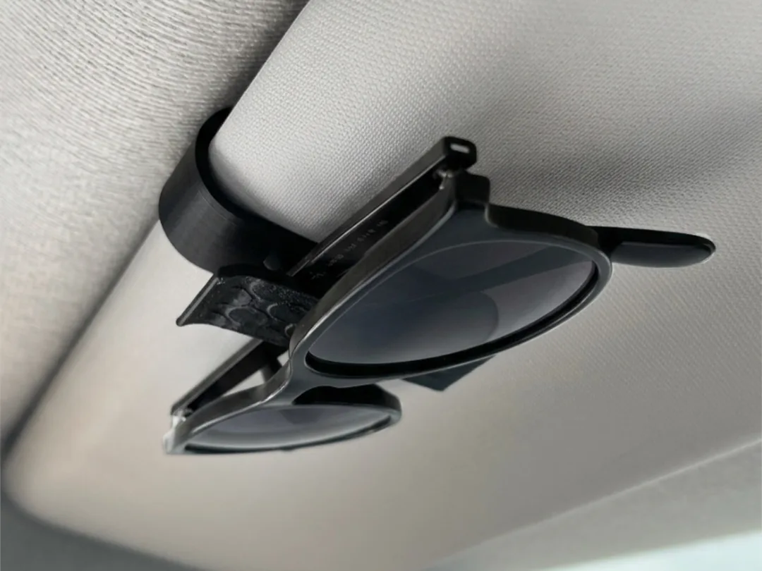 Porta gafas para visera del carro