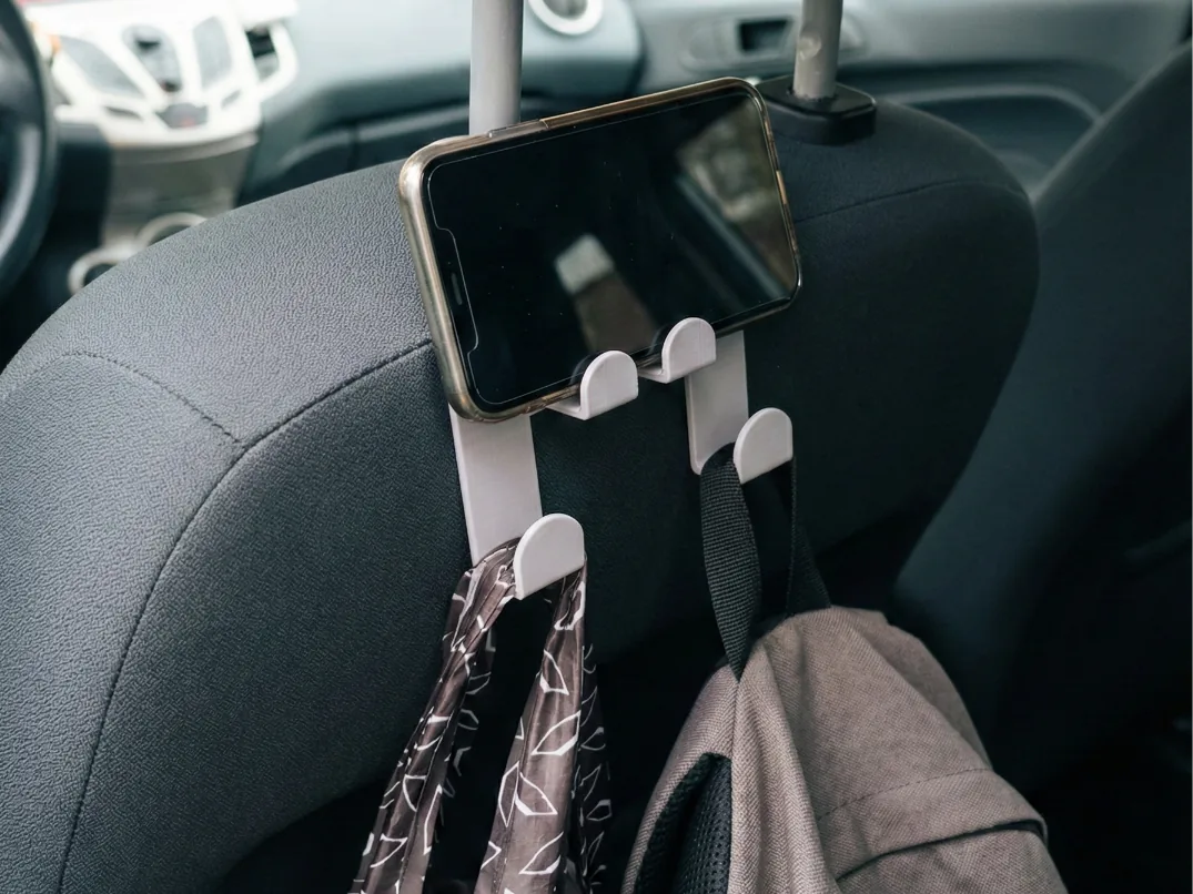 Gancho de cabecera con soporte de celular