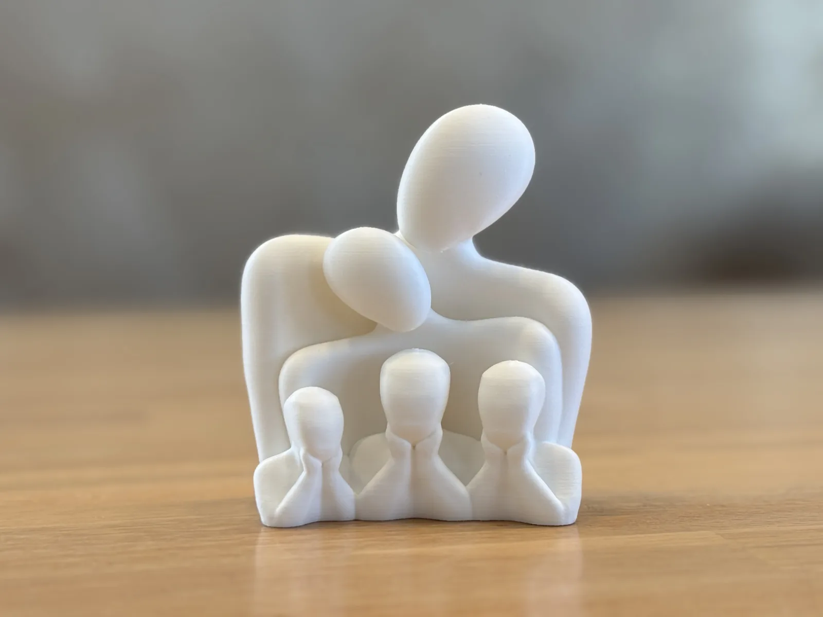 Escultura família com filhos impresso em 3D, foto 3