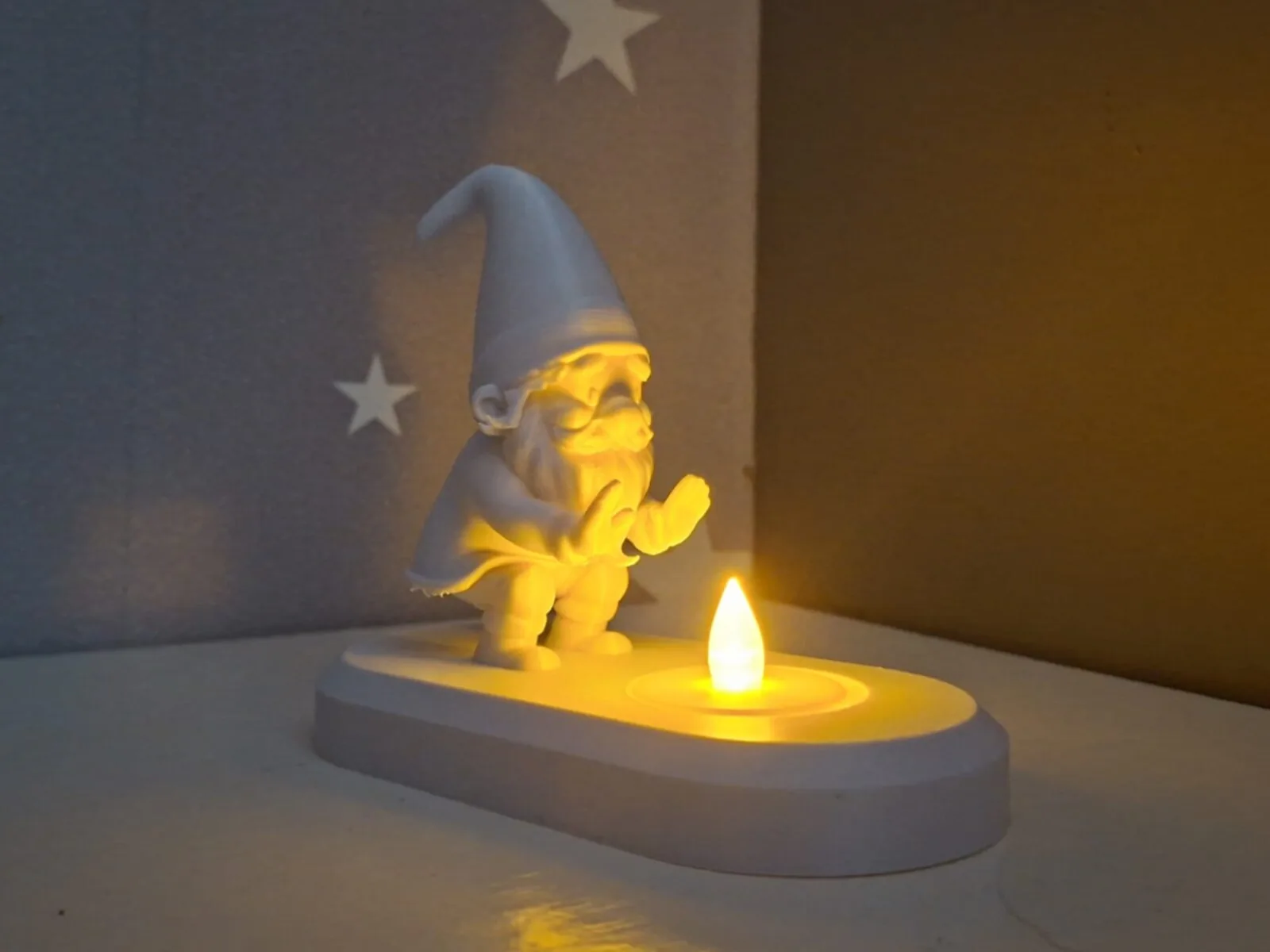 Gnome warming himself by the LED tealight