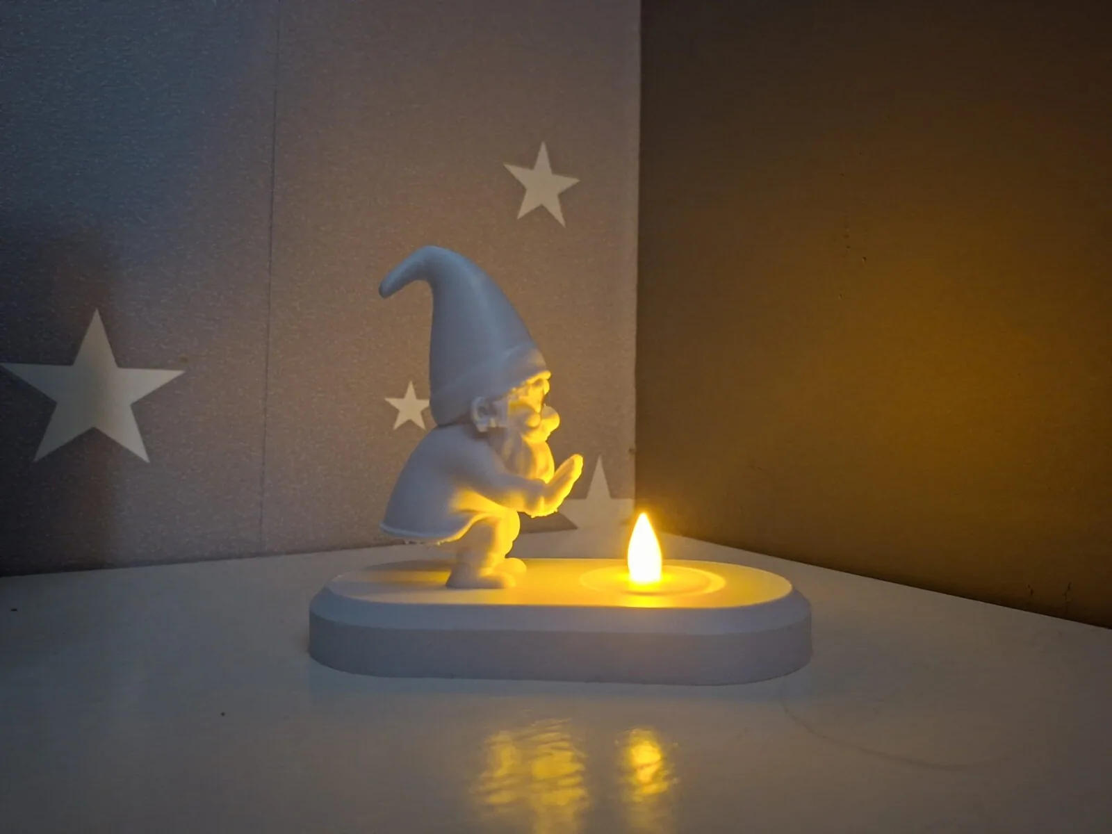 3D printed Gnome warming himself by the LED tealight, photo 3