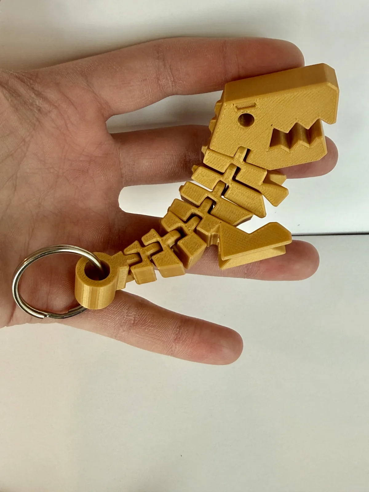 Llavero dinosaurio T-rex flexible impreso en 3D, foto 4