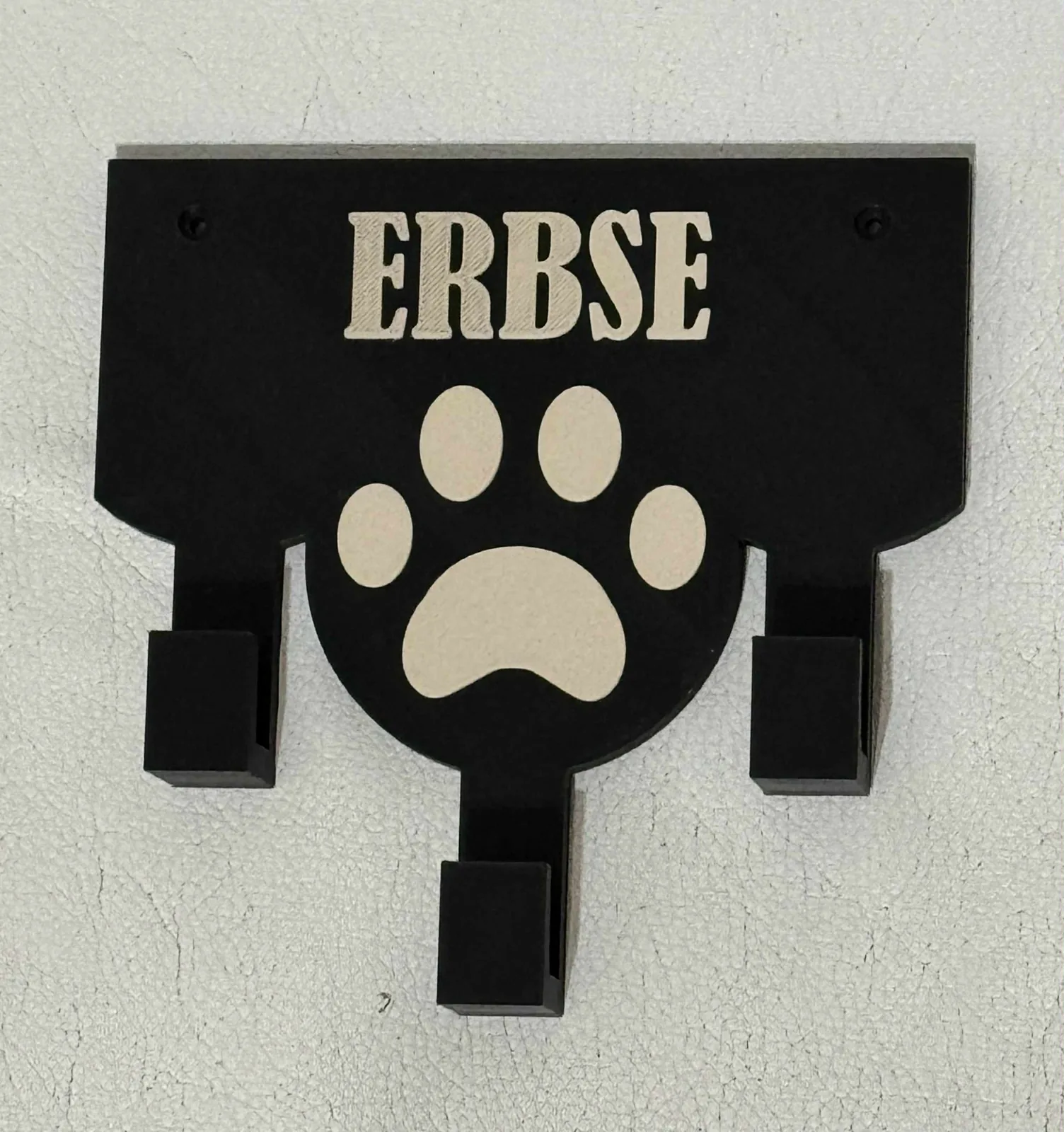 Colgador de correas con nombre