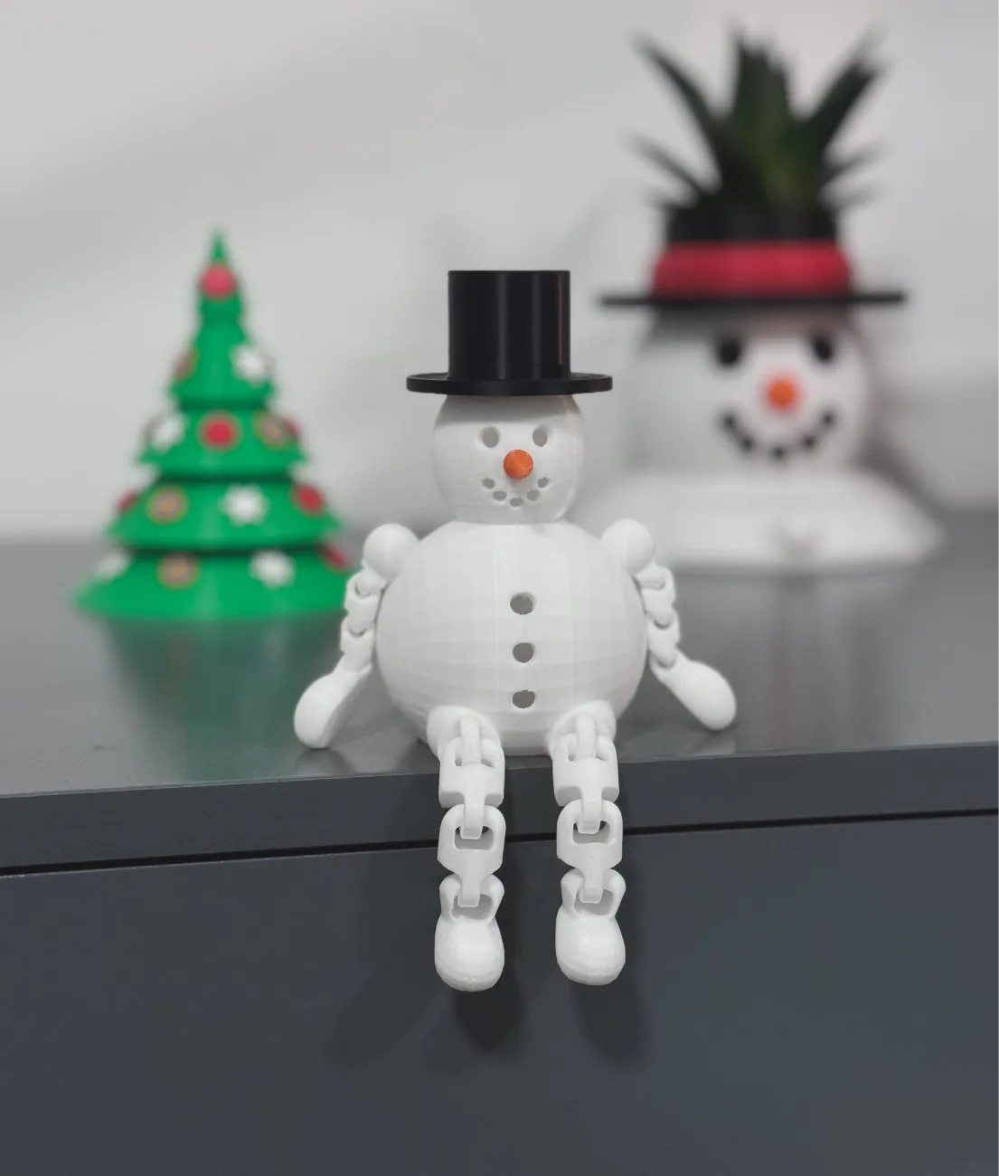 Boneco de neve articulado sentado