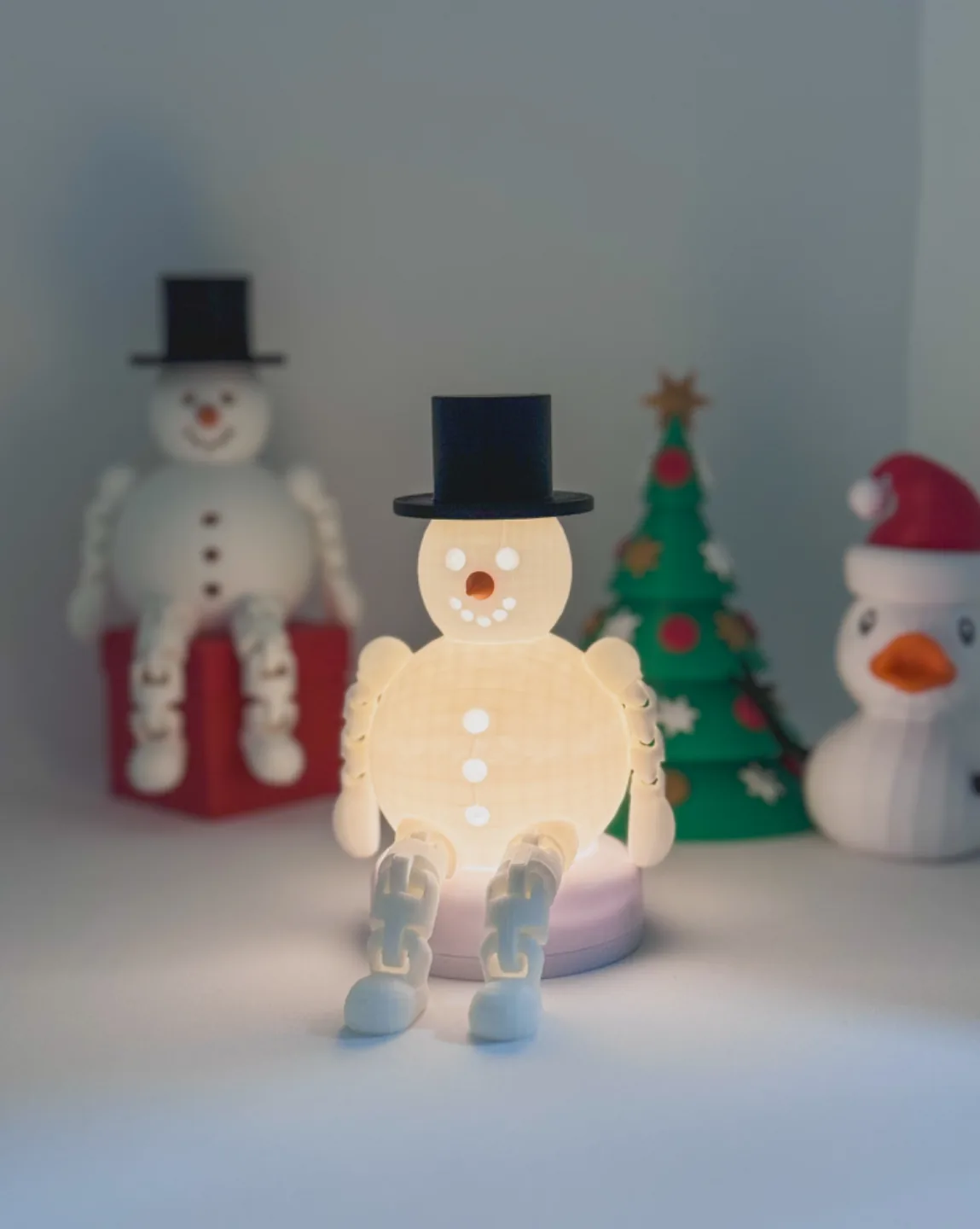 Boneco de neve articulado sentado impresso em 3D, foto 3