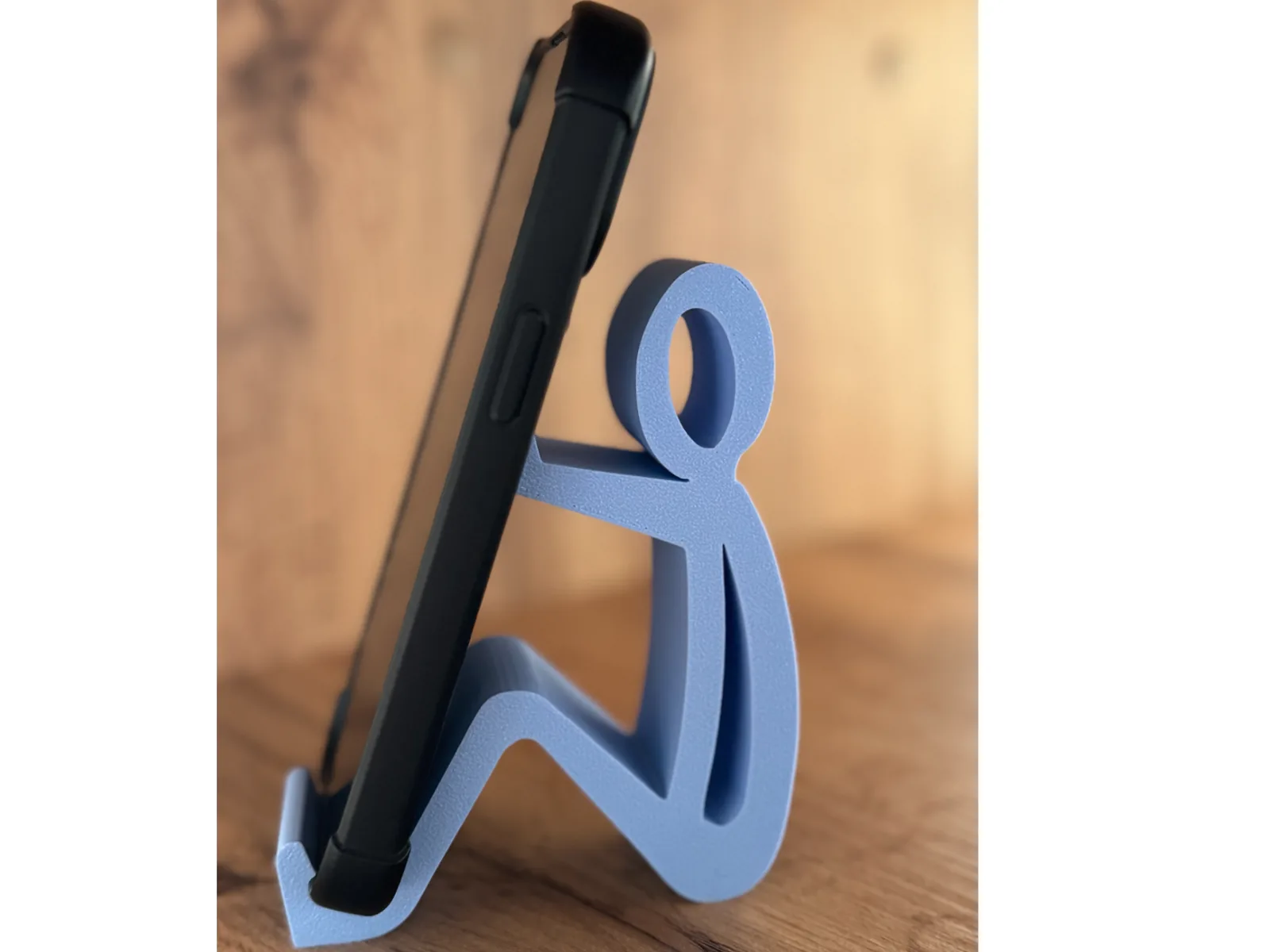 Soporte de celular figura de hombre sentado