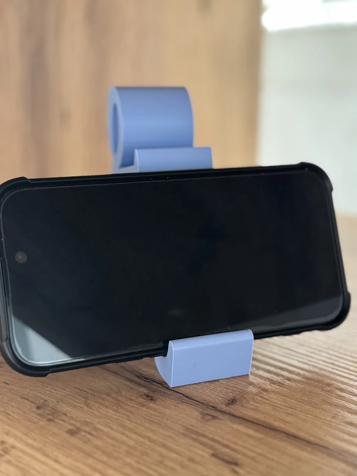 Soporte de celular figura de hombre sentado impreso en 3D, foto 3